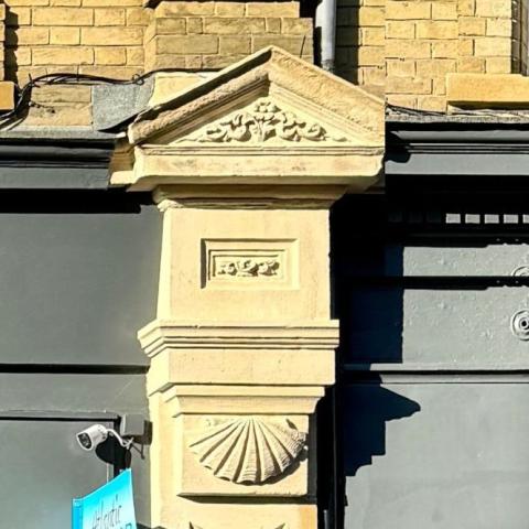 Delicately carved triangular pediments (fig 127b)