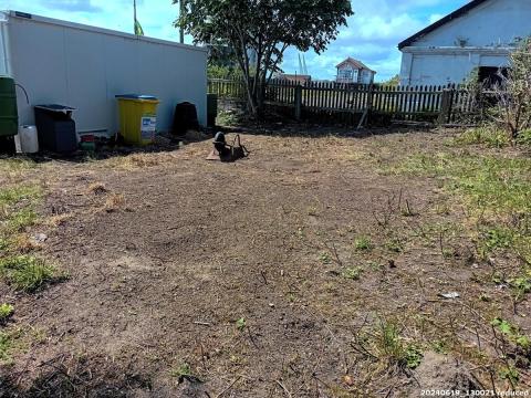 Photo of cleared land behind shed
